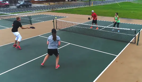 playing pickleball outdoors